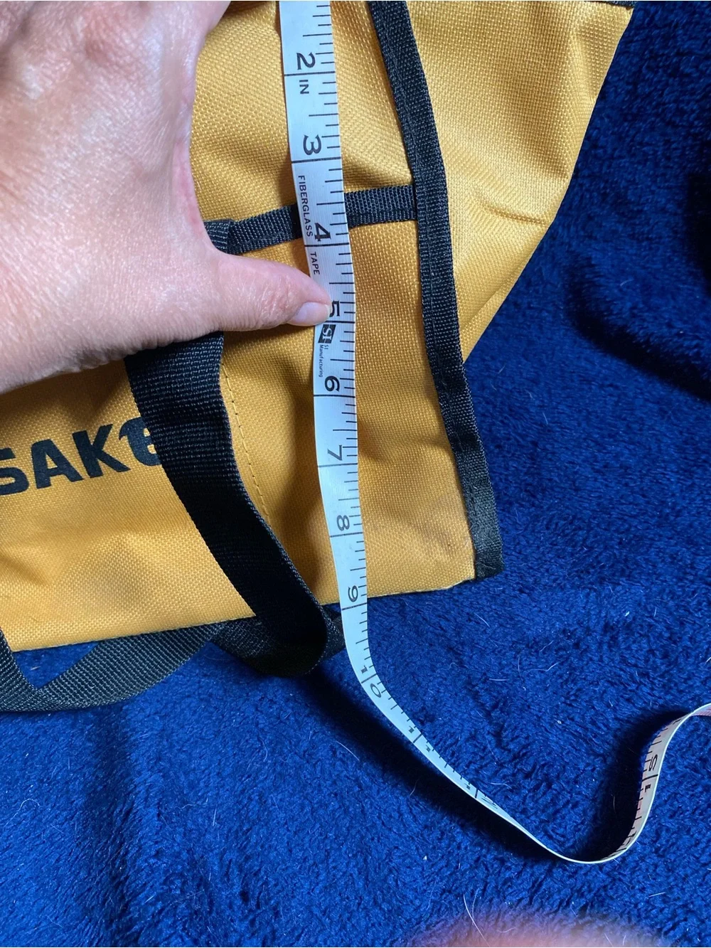 Small gold and black tool bag with safety glasses- Saker